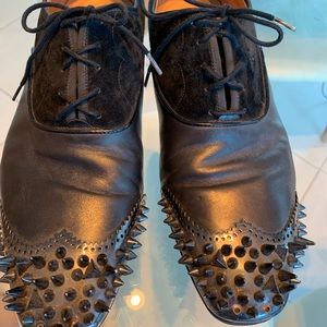 Christian Louboutin spiked black tie dress shoe